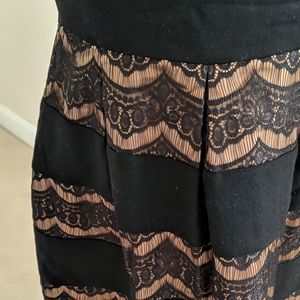 Black cocktail dress with lace skirt